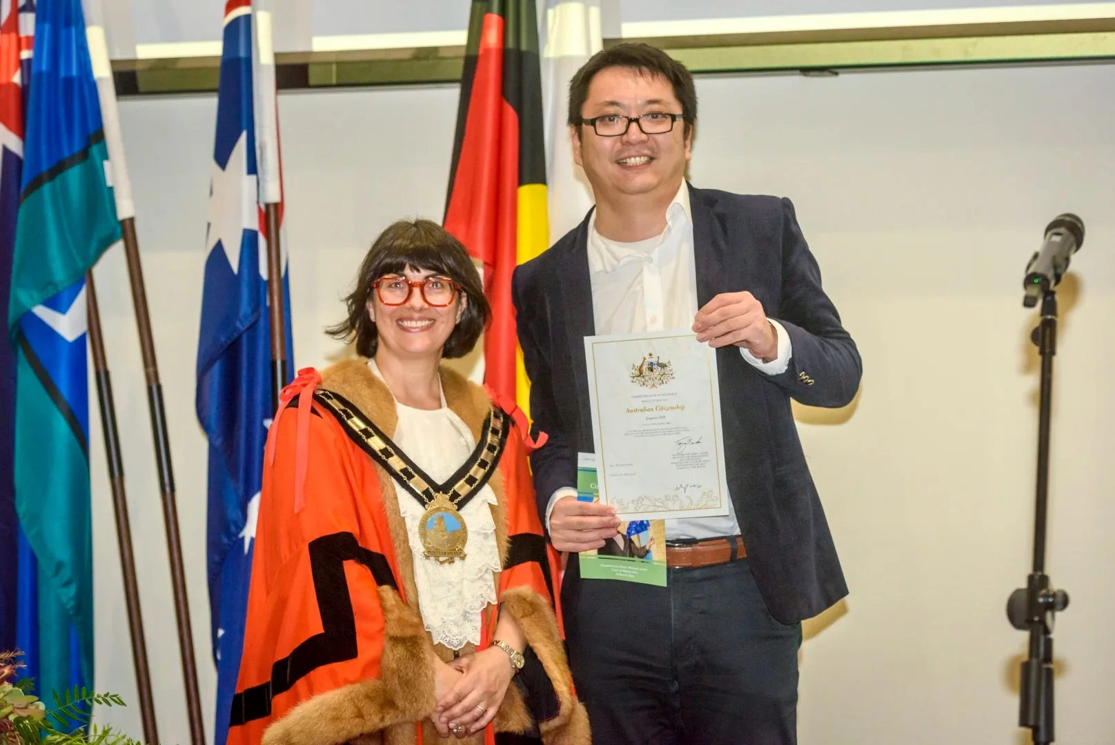 Mayor presenting certificate