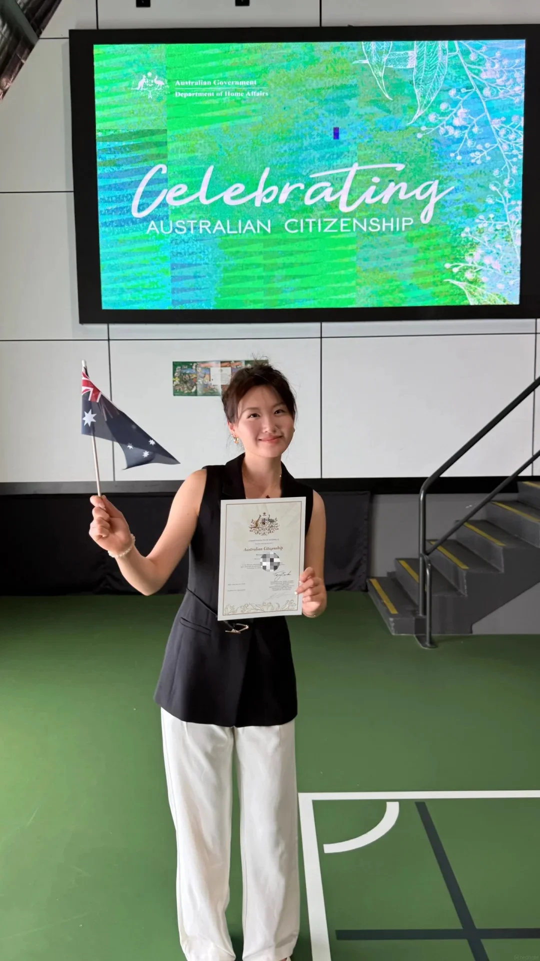 Woman celebrating Australian citizenship